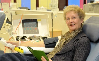 A older woman sitting in a hospital chair